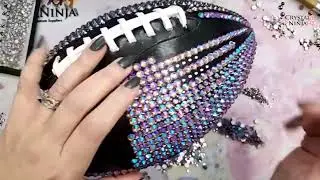 In this tutorial, I demonstrate the process of rhinestoning a football using the cushion method or p