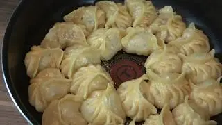 Korean style dumplings in a frying pan.