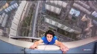 man almost falls off building while taking a selfie