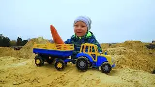 Leo with Tractors is having fun playing in the sand