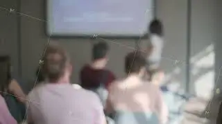 People attending a presentation in a conference room setting