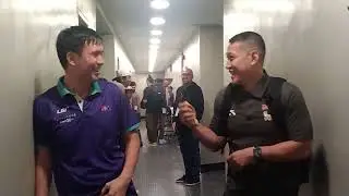 NCAA coaching rivals Charles Tiu of St Benilde and San Beda's Yuri Escueta having some light moment