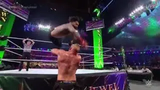 Roman Reigns flies at Brock Lesnar throught the ropes at Crown Jewel 2021