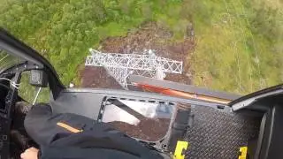Powerline mast erection with helicopter.