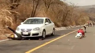Longboarder Crashes Head First Into Oncoming Car