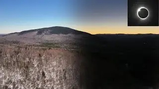Eclipse shadow sweeps over mountains