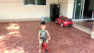 Tommy riding his Puky bike