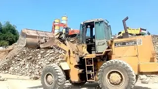 Rock dredging excavator heavy equipment |  rock lift loader |  dump truck unloading rocks