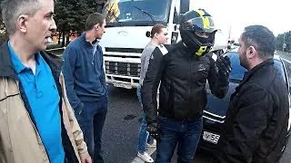 Biker vs car driver. Fight and road rage after crash