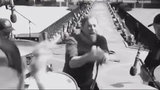Coldplay performing in hard-rock style