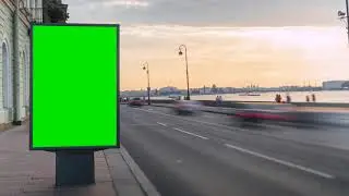 billboard with a green screen on the busy roadway