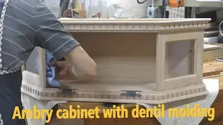 Ambry cabinet with dentil molding