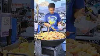 Fried meatballs in a giant pan, popularly eaten in Chiang Mai, Thailand. #streetfood #thaistreet