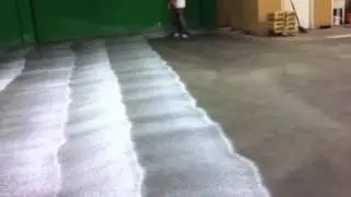 Applying concrete sealer to new fresh floor