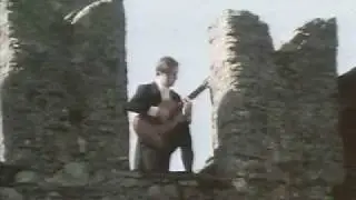 DANTE BRENNA AND HIS GUITAR ON THE CASTLE OF BELLINZONA -