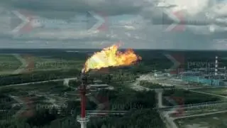 Clouds of fire from a pipe at a gas plant