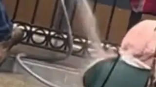 jerk sprays homeless woman with water hose rant