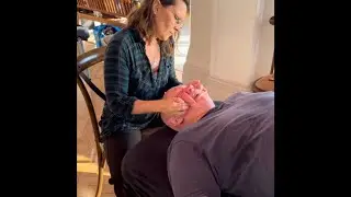 Raynor massage student clinic in London. Students practicing deep tissue massage techniques