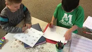 j and k working at table