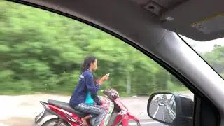 Young mother text phone while she driving with her young daughter