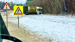 First snow. Truck on the side of the road! Motor grader clearing snow.