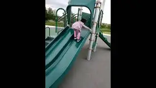 James Cheng and Jacqueline Cheng children playground slide climbing upward