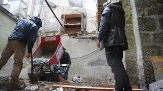 Pouring the foundation for the wall.