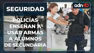 Policías le prestan sus armas a alumnos de secundaria