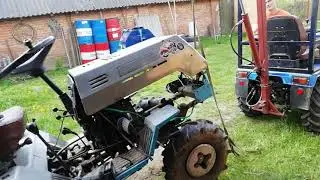 Repairing an AMZhK-8 minitractor in the countryside