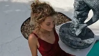 Preview of Nathalia swimming fully clothed  her red formal dress