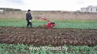 The Salute-100 walk-behind tractor plows by itself!