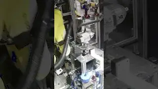High-speed precision robotic labeling system with FANUC robots 