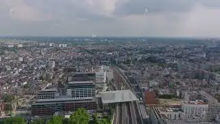 Aerial perspective of Antwerp, Belgium highlights the city skyline, with railway tracks weaving