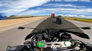 Ninja H2 racing through traffic with a GSXR 1000