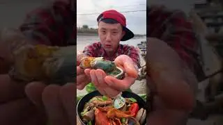 Fisherman eating clam on the boat