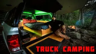 Truck Camping In Rain With Campfire And Tarp Shelter