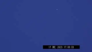 White high altitude triangular object.