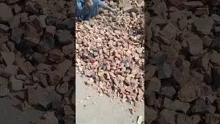 Hardworking Mason Breaking Brick Into Pieces Which Will Be Used In Foundation Work Of Building
