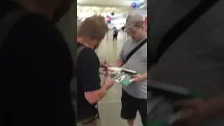 Michael Anthony of Van Halen signing autographs
