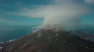 Clouds Rests On Top Of A Mountain