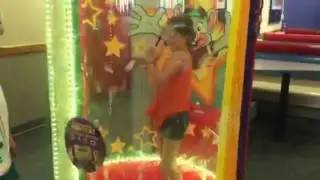 Carlee in the Chuck E Cheese ticket blaster