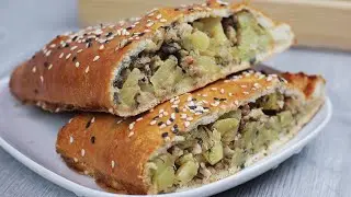 Layered pie with potatoes and minced meat. Pie made from ready-made puff pastry with filling