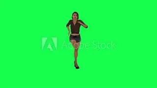 Beautiful woman in brown dress, high heels and black shorts coming from opposite angle with dancing