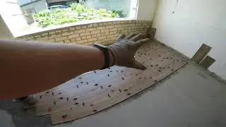 Laying floor tiles in a summer kitchen. Semi-dry screed.