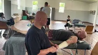 Raynor Massage for PTSD. Brandon massaging his friend Dave, who is an ex policeman