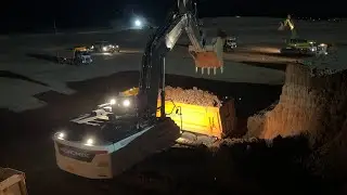 Hidromek Excavator You're loading a truck at night.