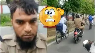 Policeman was chasing the girl in the middle of the road, when the woman stopped..