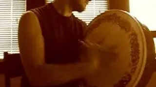 Man Playing Bodhran (Irish Drum)