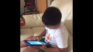 Sitting on a toilet!