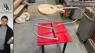 This Guitar Spraying Stand is a Game Changer